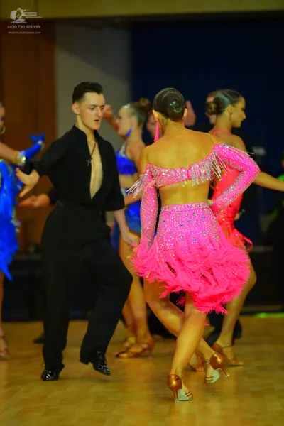 Dancesport competitor: Male dancer: black long-sleeved shirt and black trousers