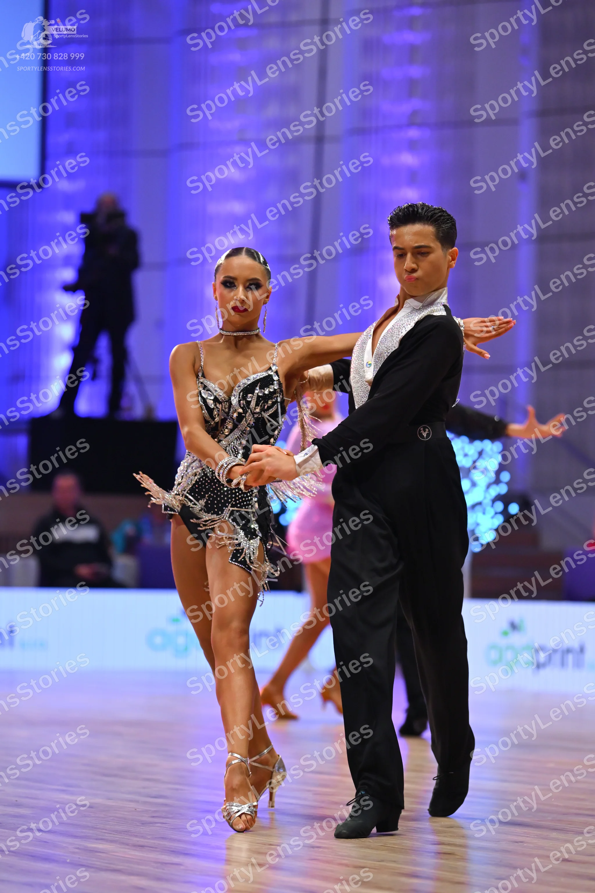 Dancesport competitor: Male dancer: black suit with light-colored satin lapels