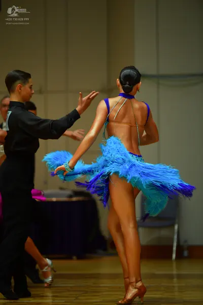 Dancesport competitor: Male dancer: black long-sleeved shirt and black trousers
