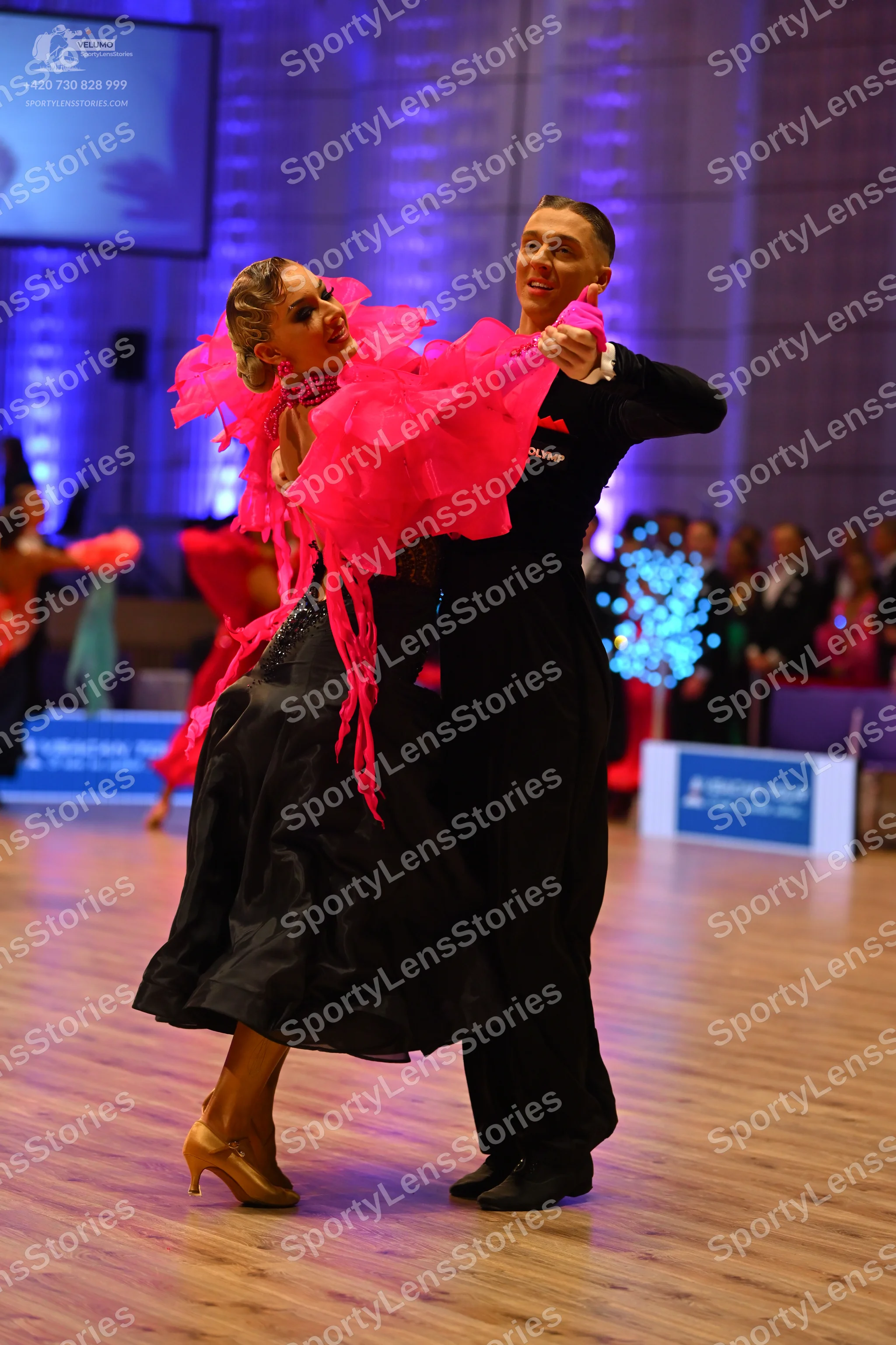 Dancesport competitor: Male dancer: black long-sleeved top and black trousers