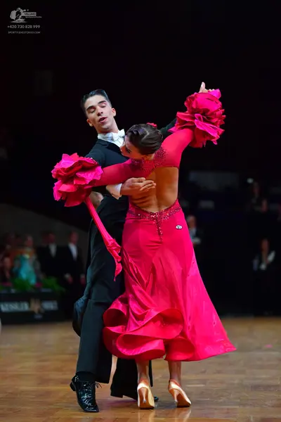 Dancesport competitor: Male dancer: black suit, white shirt, and white bowtie