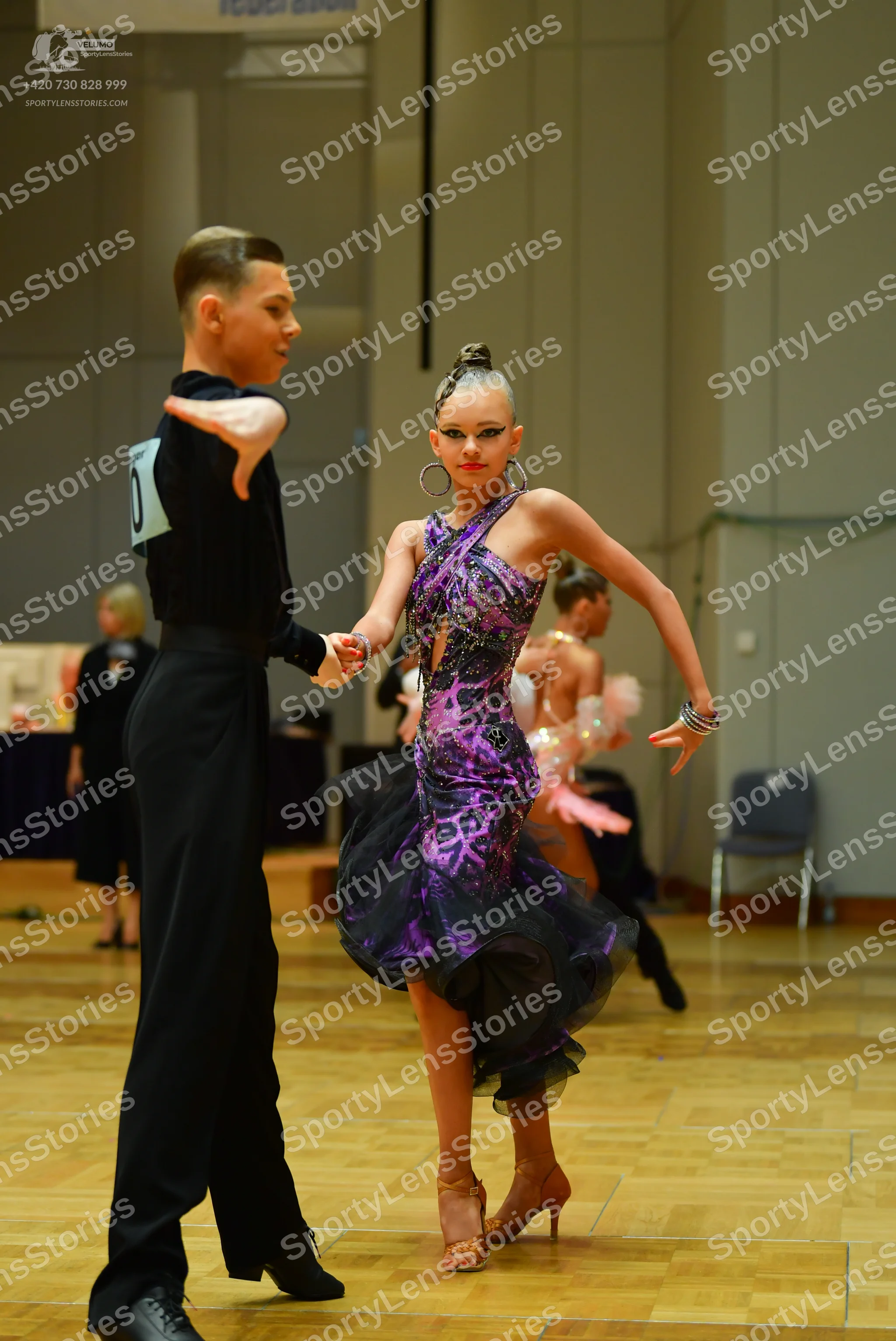 Dancesport competitor: Male dancer: black long-sleeved dance shirt and black trousers