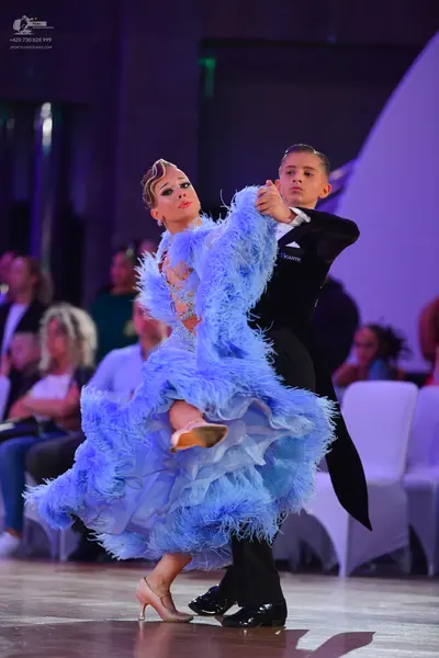 Dancesport competitor: Male dancer: black suit with a white shirt and black trousers