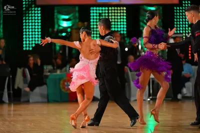 Dancesport competitor: Male dancer 1: black suit with long sleeves