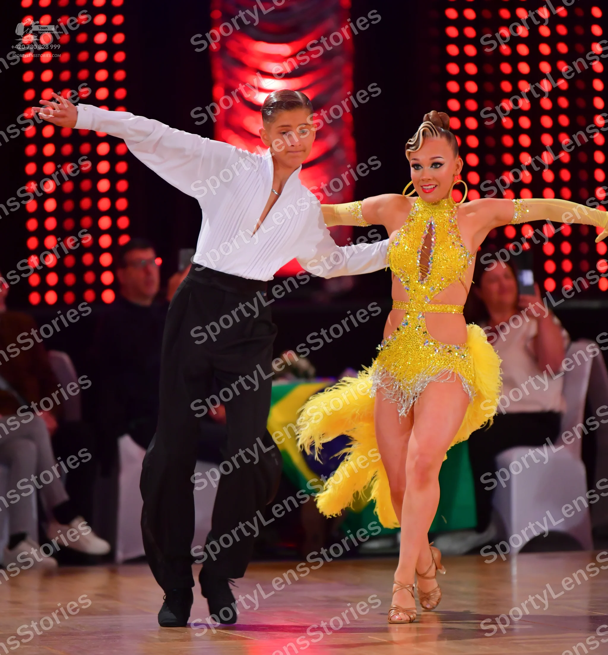 Dancesport competitor: Male dancer: white long-sleeved shirt and black trousers