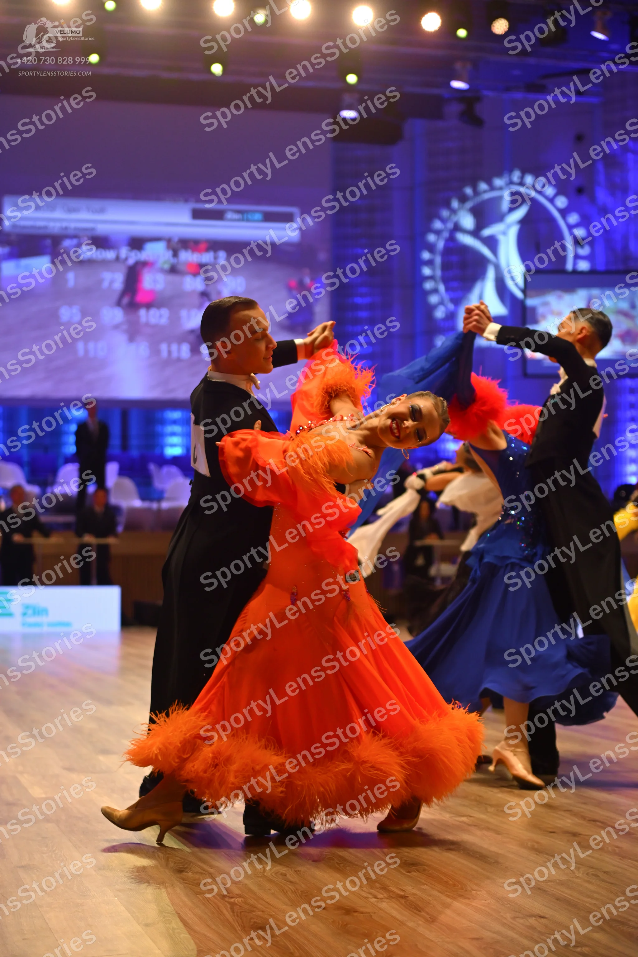Dancesport competitor: Male dancer (left): black suit