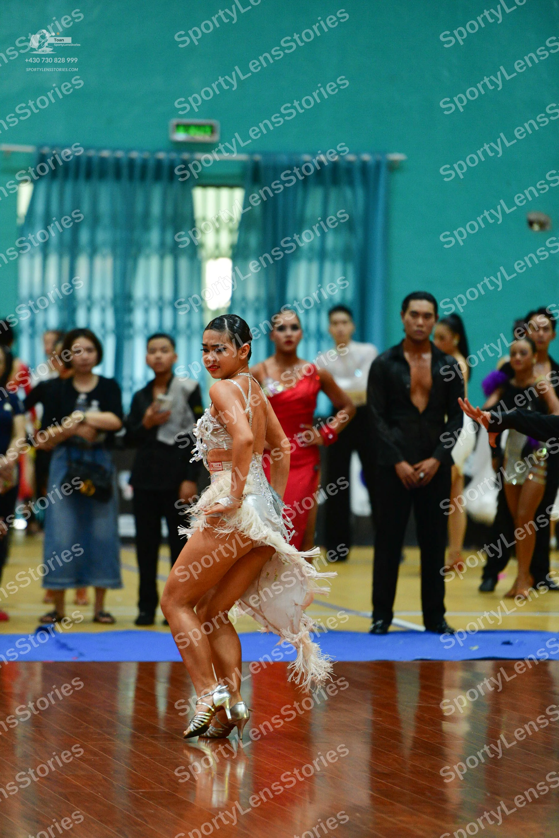Dancesport competitor: Male**

*   **Color:** Black
*   **Fabric:** Likely satin or a similar smooth fa