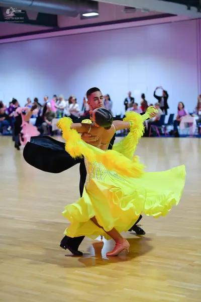 Dancesport competitor: Male dancer: black suit
