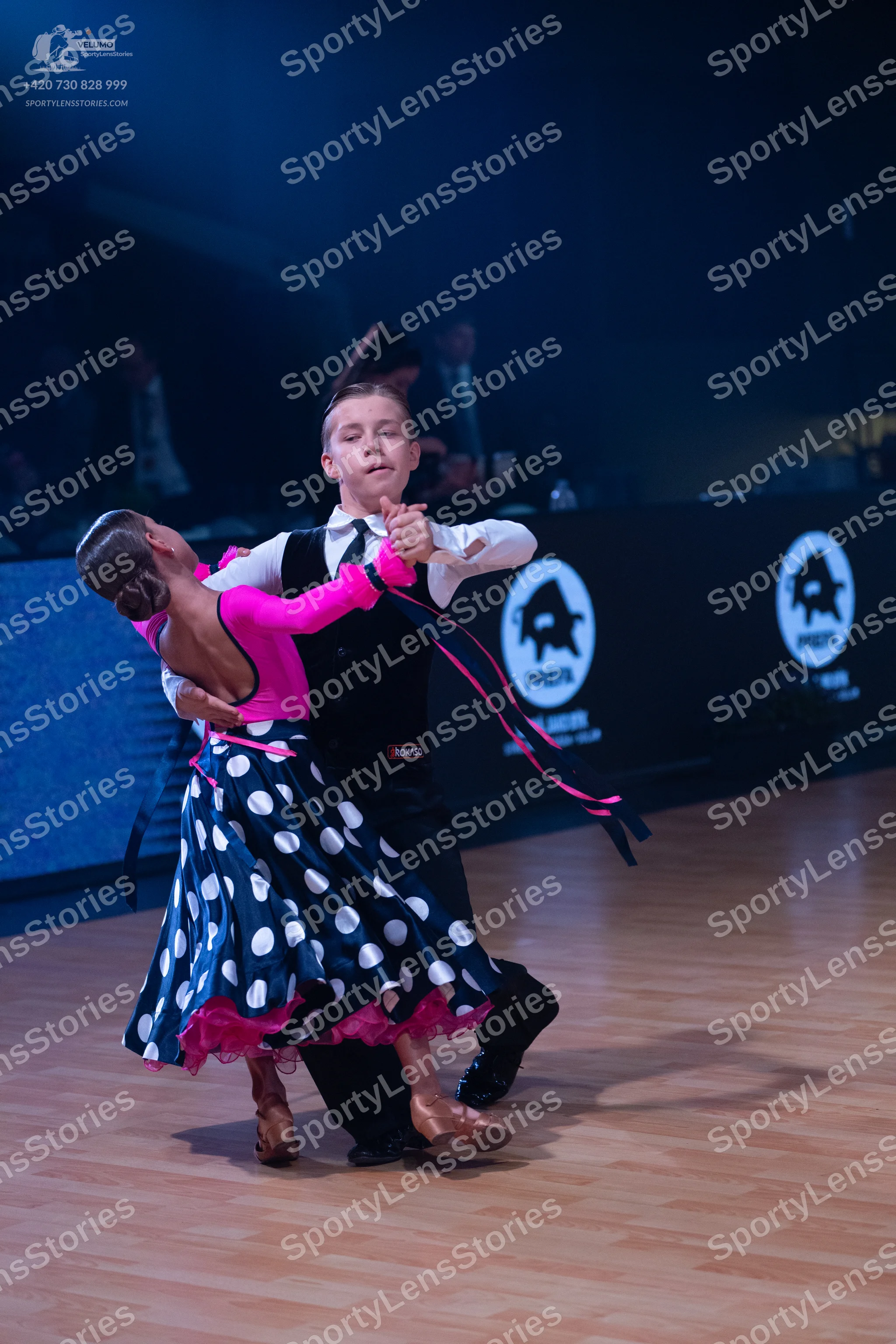Dancesport competitor: Male dancer: white long-sleeved shirt, black waistcoat, and black trousers