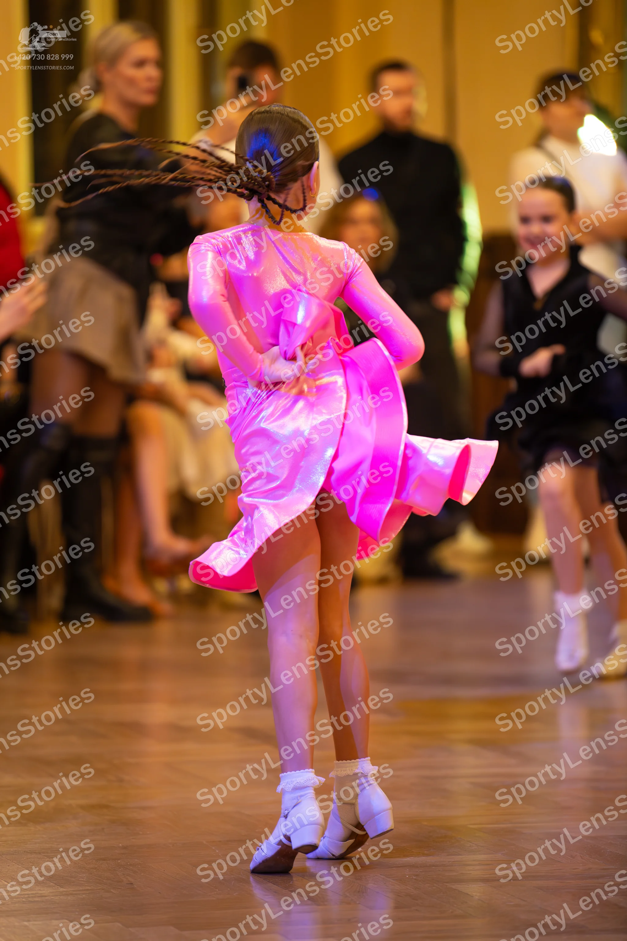 Dancesport competitor: **  Female: Shimmering pink, iridescent gown