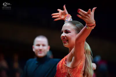 Dancesport competitor: Male dancer: black long-sleeved top