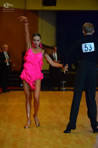 Dancesport competitor #53: Female dancer: bright pink Latin dress with fringe