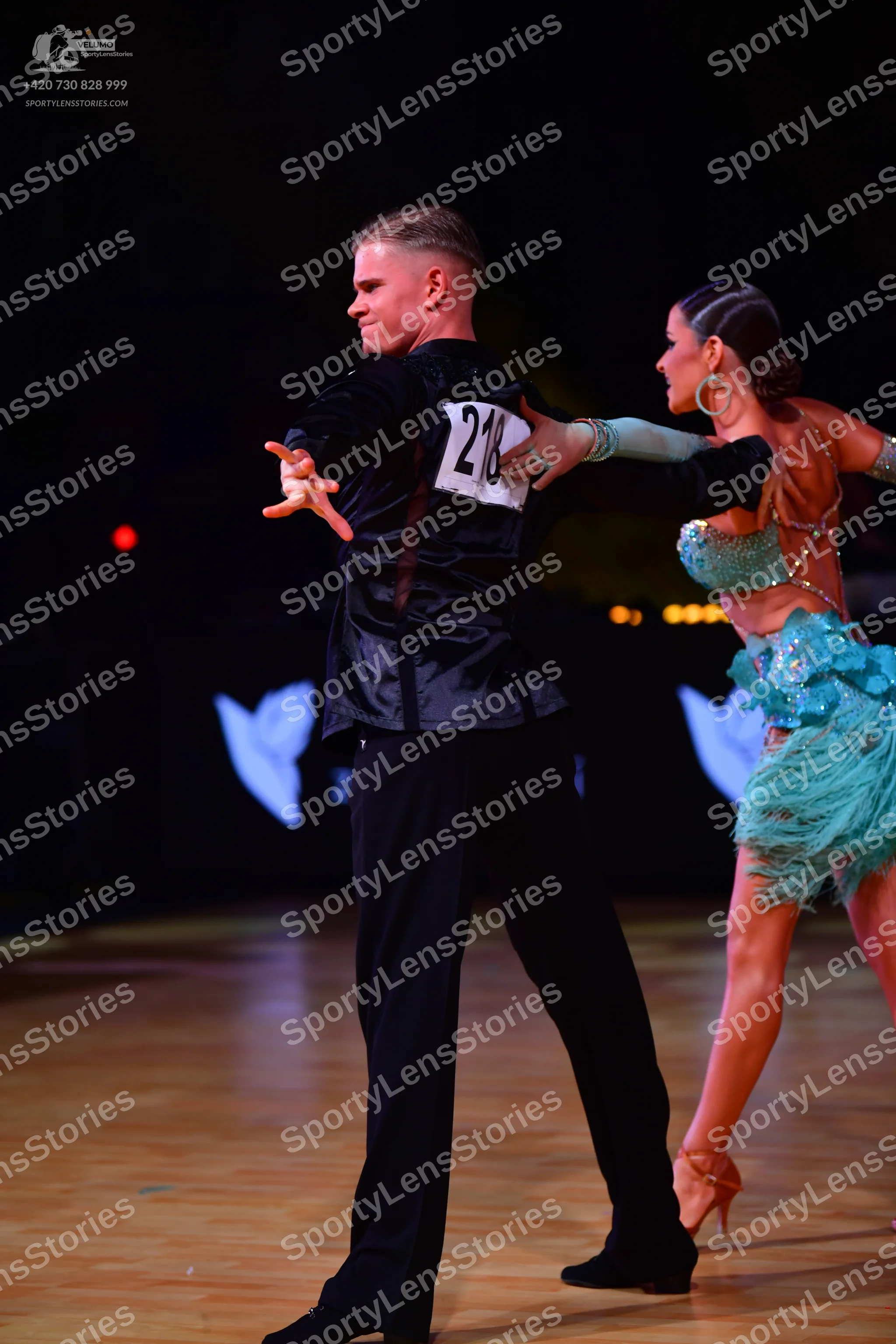 Dancesport competitor: Male dancer: black satin shirt and black trousers