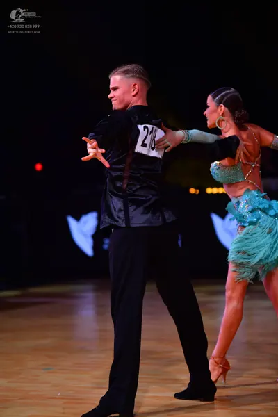Dancesport competitor: Male dancer: black satin shirt and black trousers
