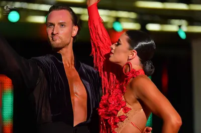Dancesport competitor: Male dancer: black open-chest shirt