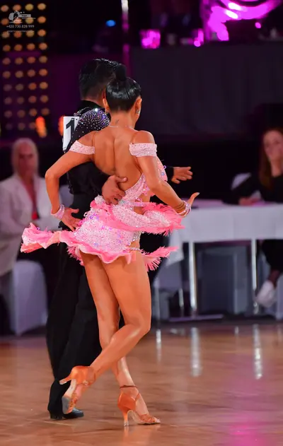 Dancesport competitor: Male dancer: black latin shirt with small crystals and black trousers