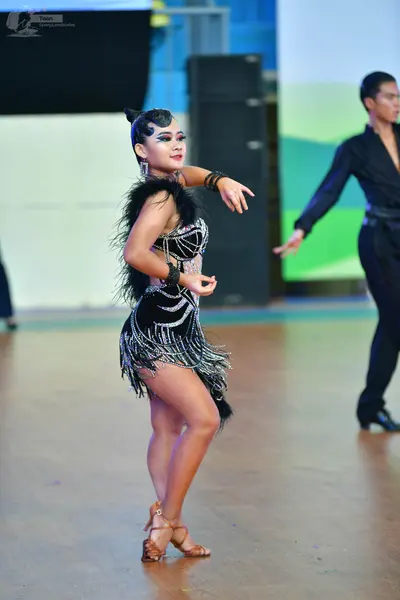 Dancesport competitor: ** Black tail suit