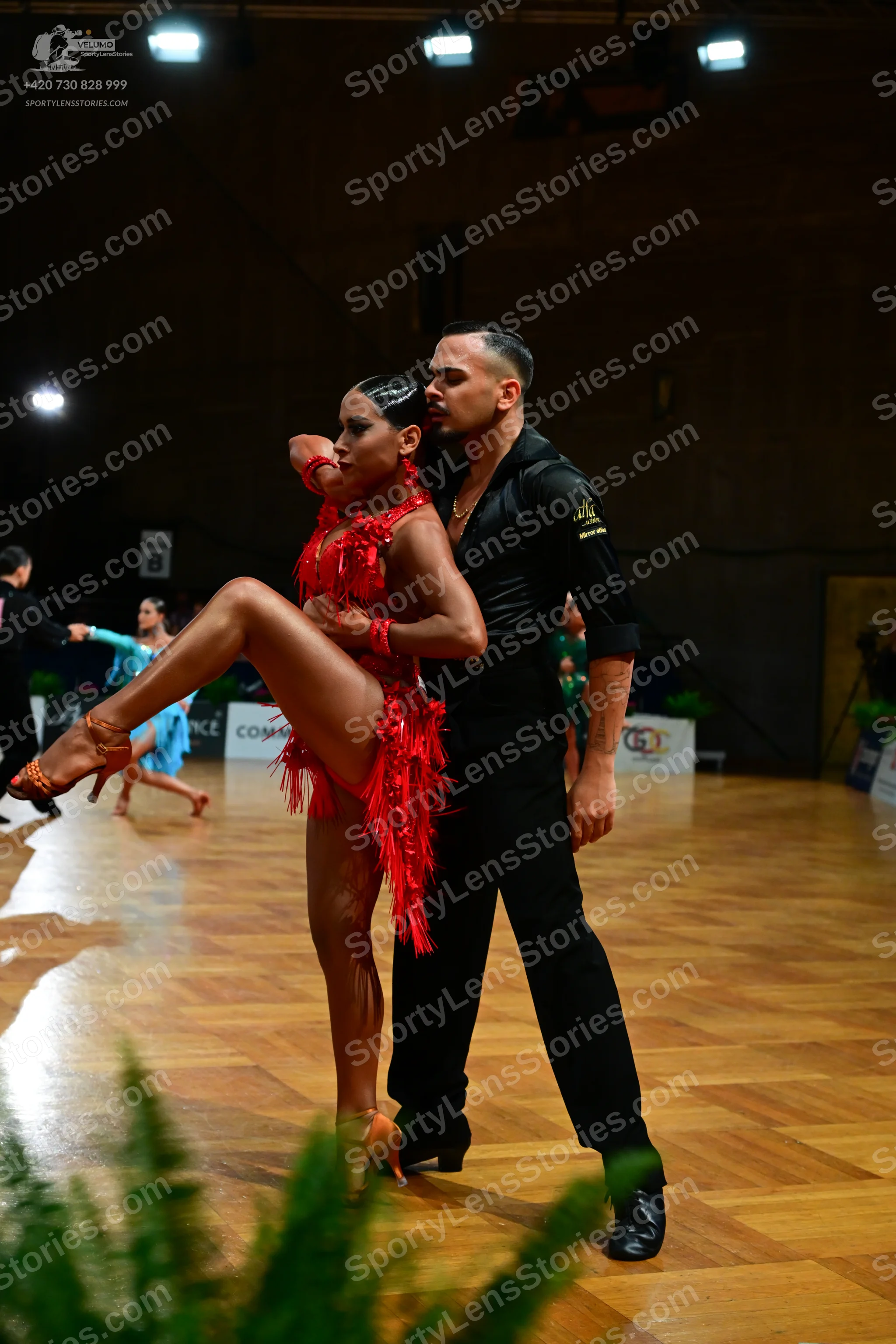 Dancesport competitor: Male dancer: black long-sleeved shirt and black trousers