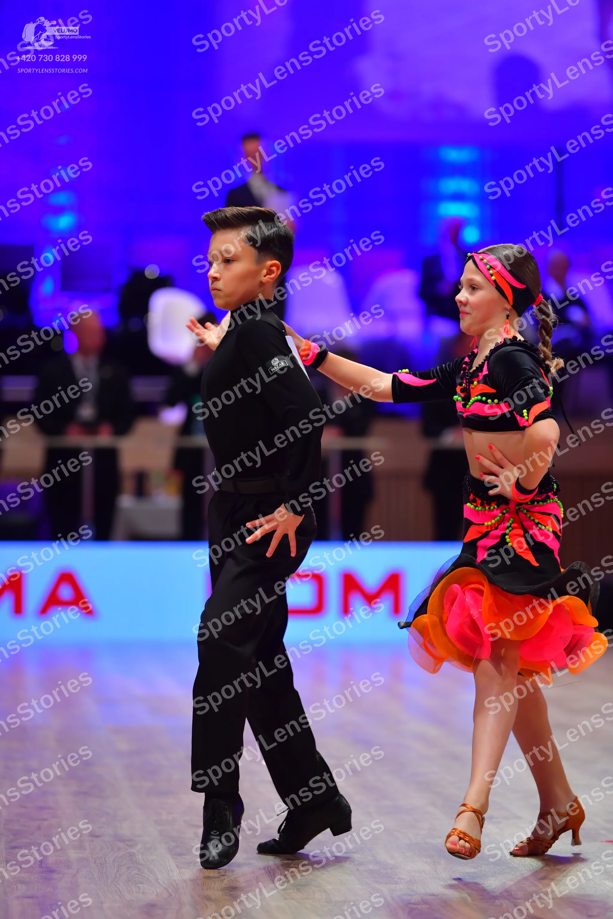 Dancesport competitor: Male dancer: black long-sleeved shirt and black trousers