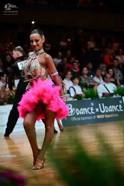 Dancesport competitor #29: Female dancer: nude-colored Latin dance top with silver sequins and crystals, a 