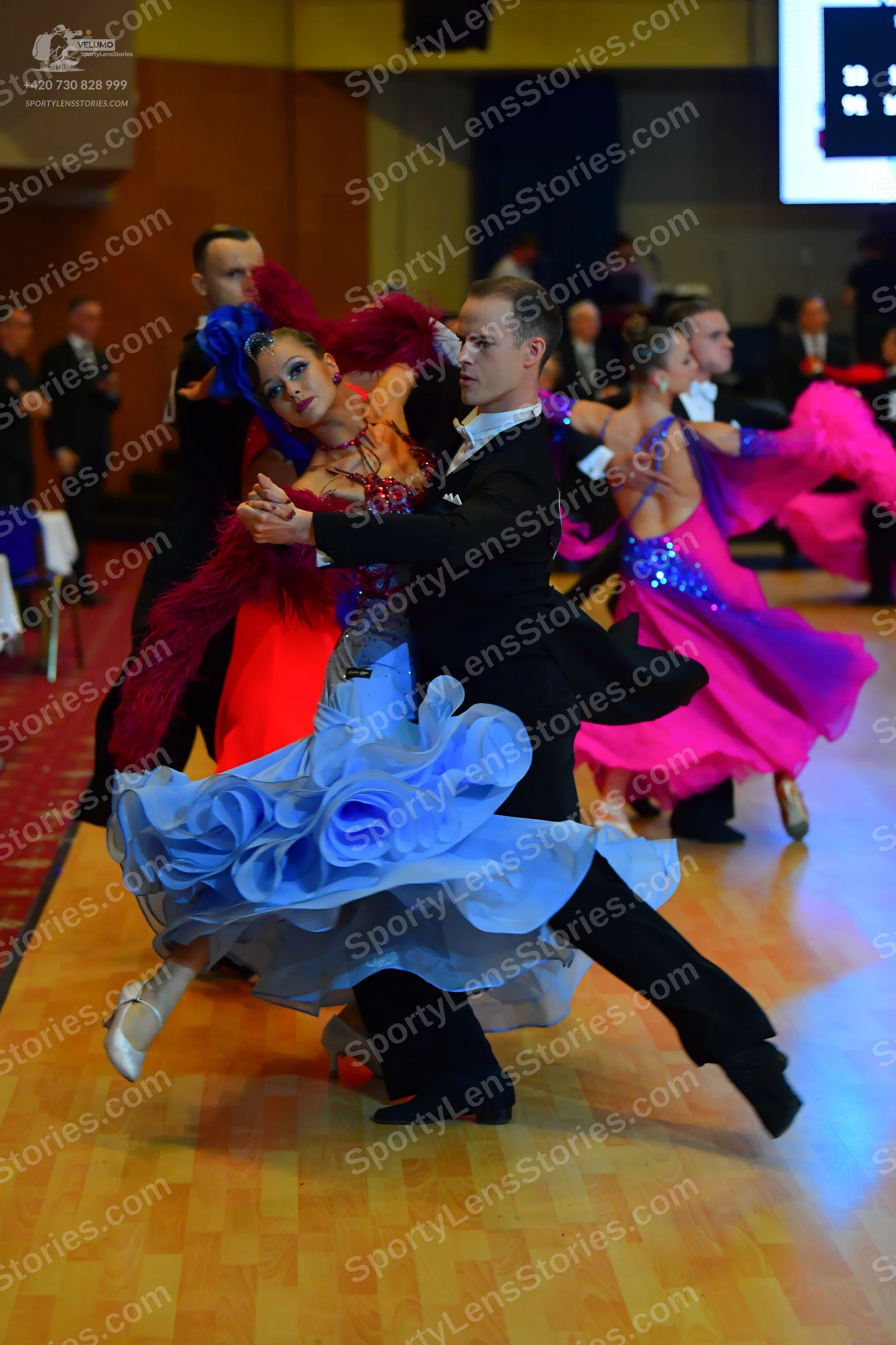 Dancesport competitor: Male dancer: black suit, white shirt, and black shoes