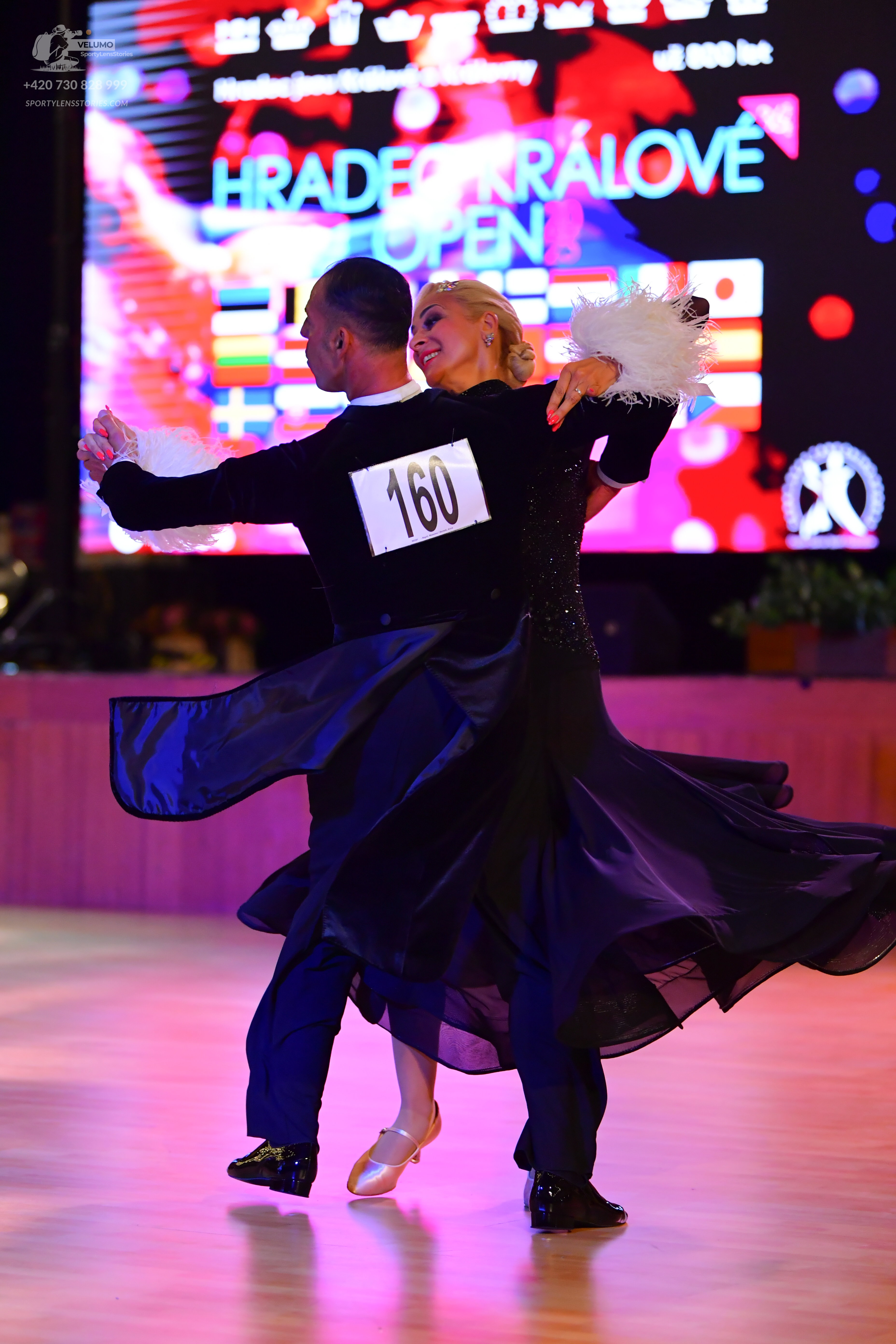 Dancesport competitor: ** Black ballroom suit
