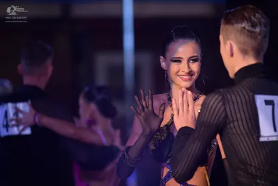 Dancesport competitor #41: Male dancer: black long-sleeved shirt with vertical stripes