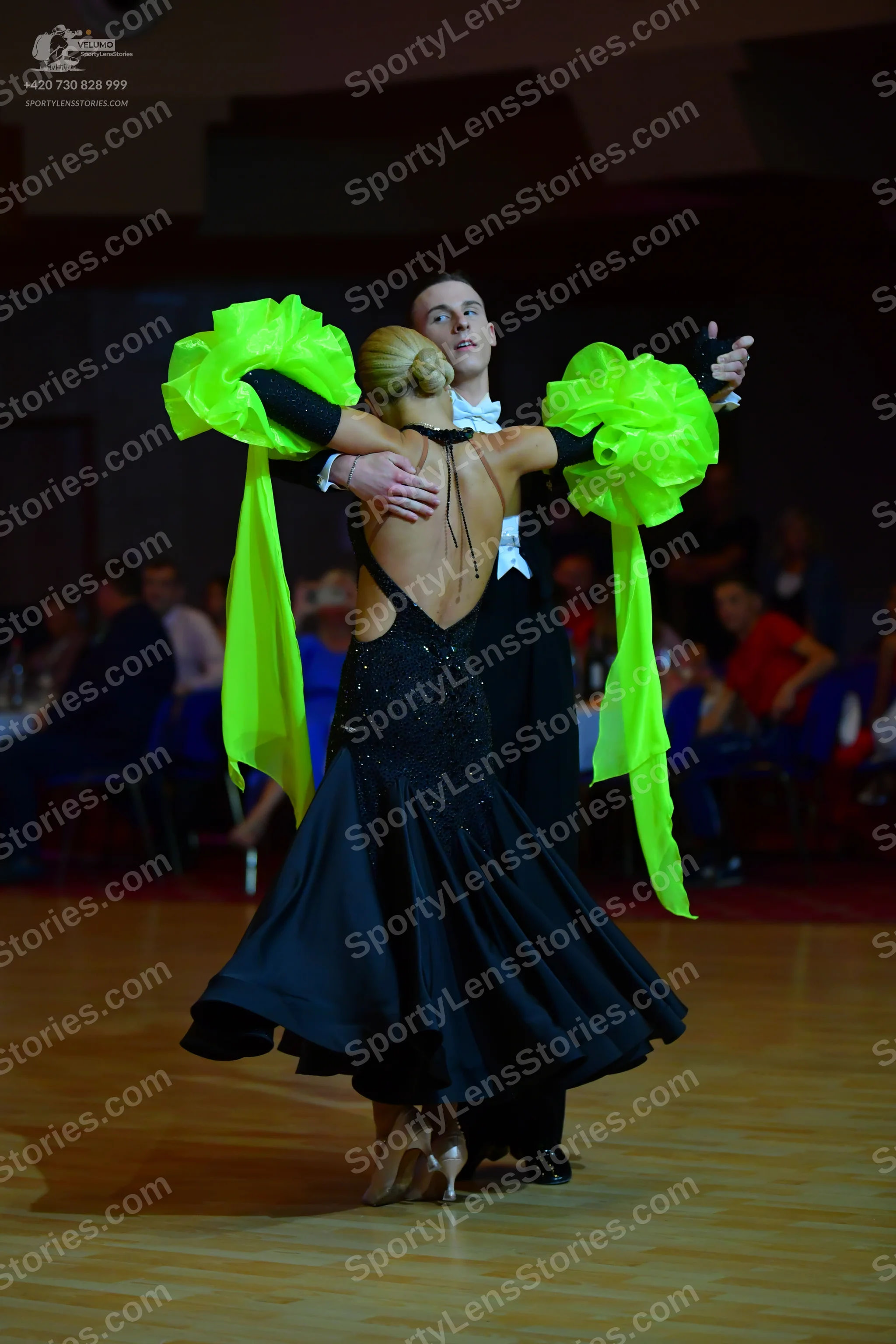 Dancesport competitor: Male dancer: black suit, white shirt, and black bow tie