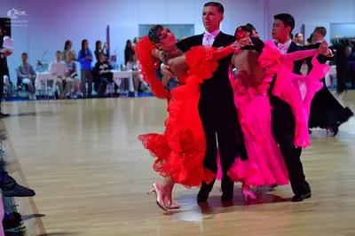 Dancesport competitor: Male dancer: black suit with white bowtie