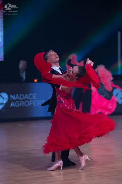 Dancesport competitor: Male dancer: black suit with white shirt