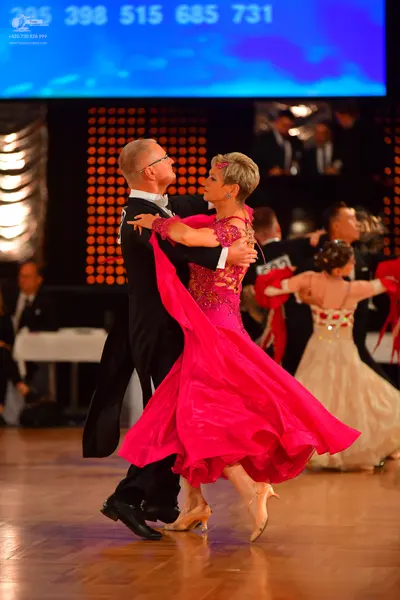 Dancesport competitor #285, #398: Male dancer: black tailcoat suit with a white shirt