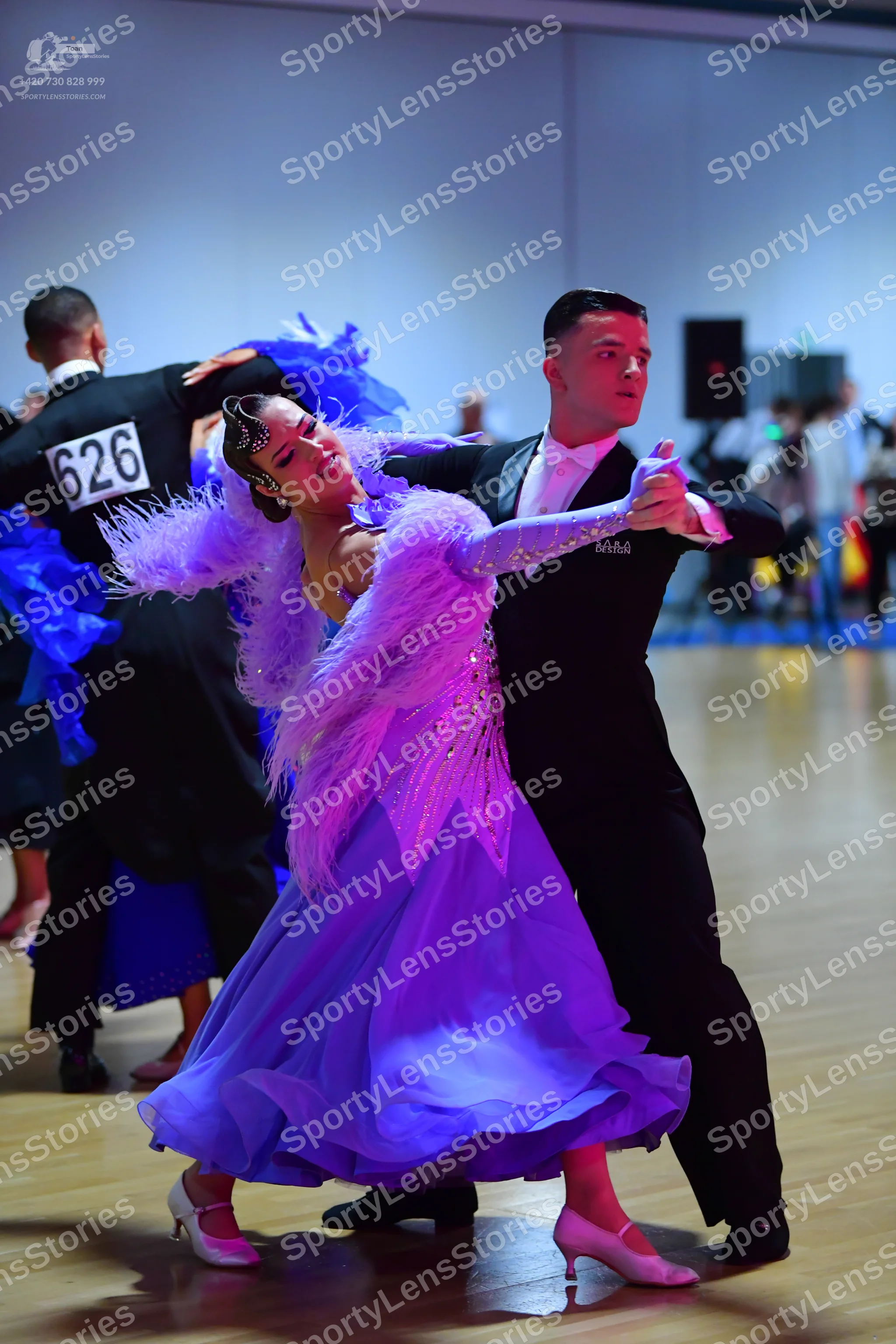 Dancesport competitor #626: Male dancer (left): black suit