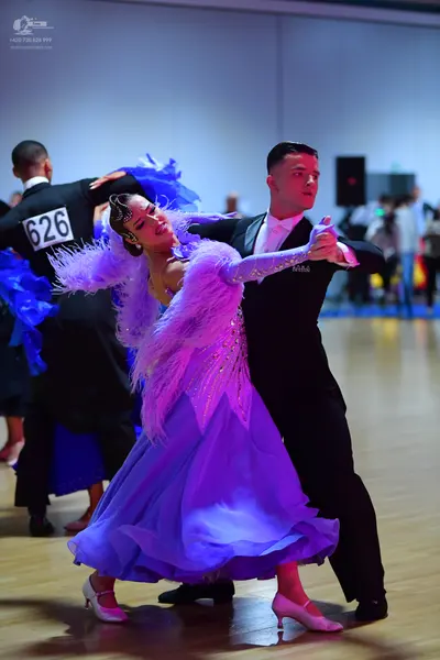 Dancesport competitor #626: Male dancer (left): black suit