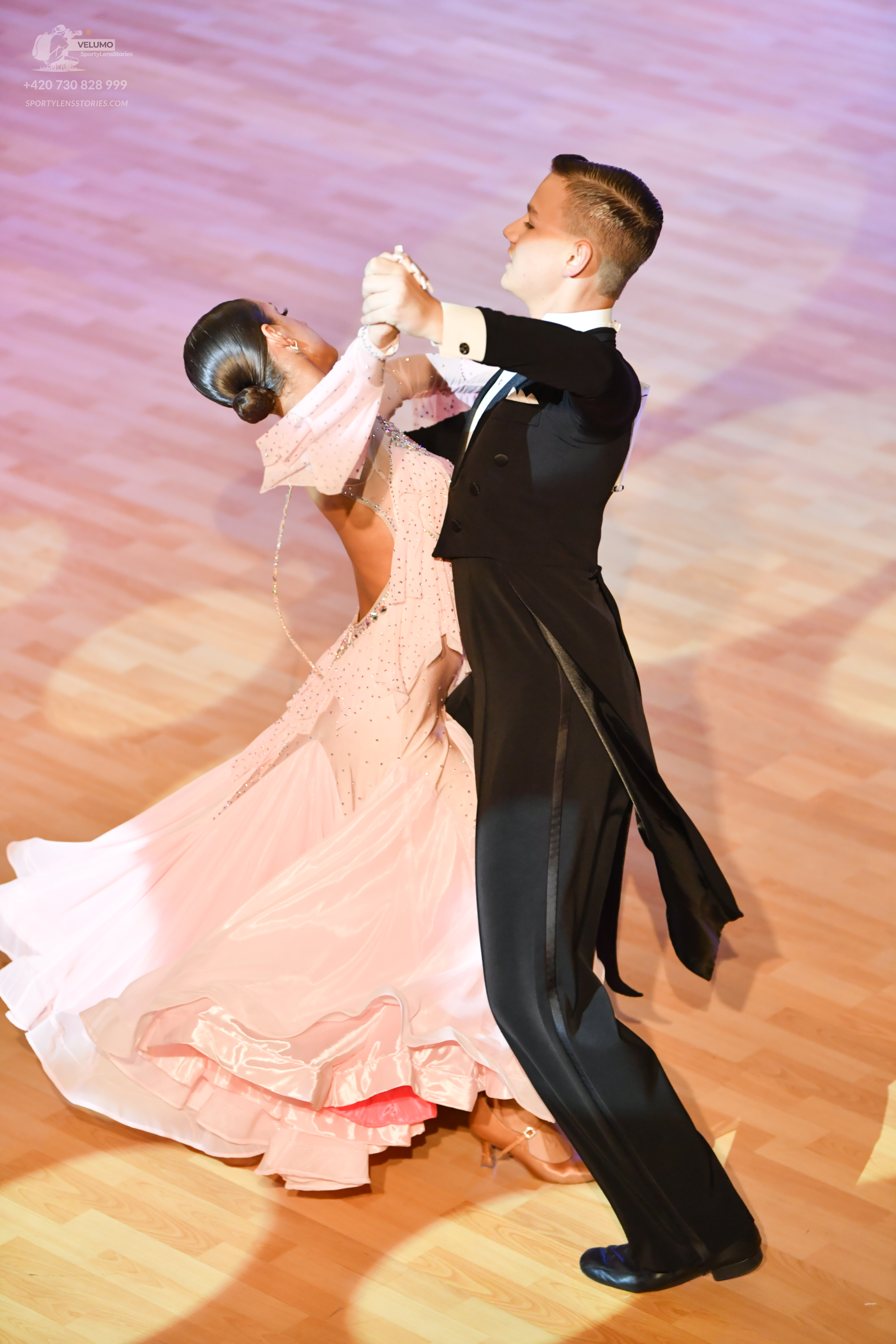 Dancesport competitor: ** Male: Black tail suit with a satin jacket, a black bow tie, and black dress s