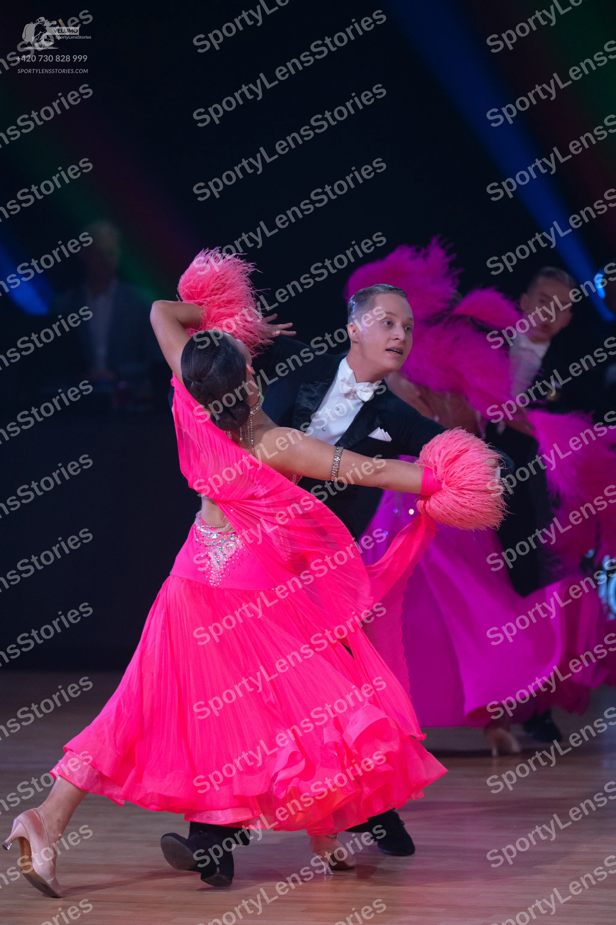 Dancesport competitor: Male dancer: black suit with a white shirt and white bow tie