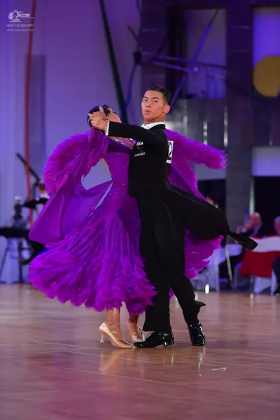 Dancesport competitor: Male dancer: black suit