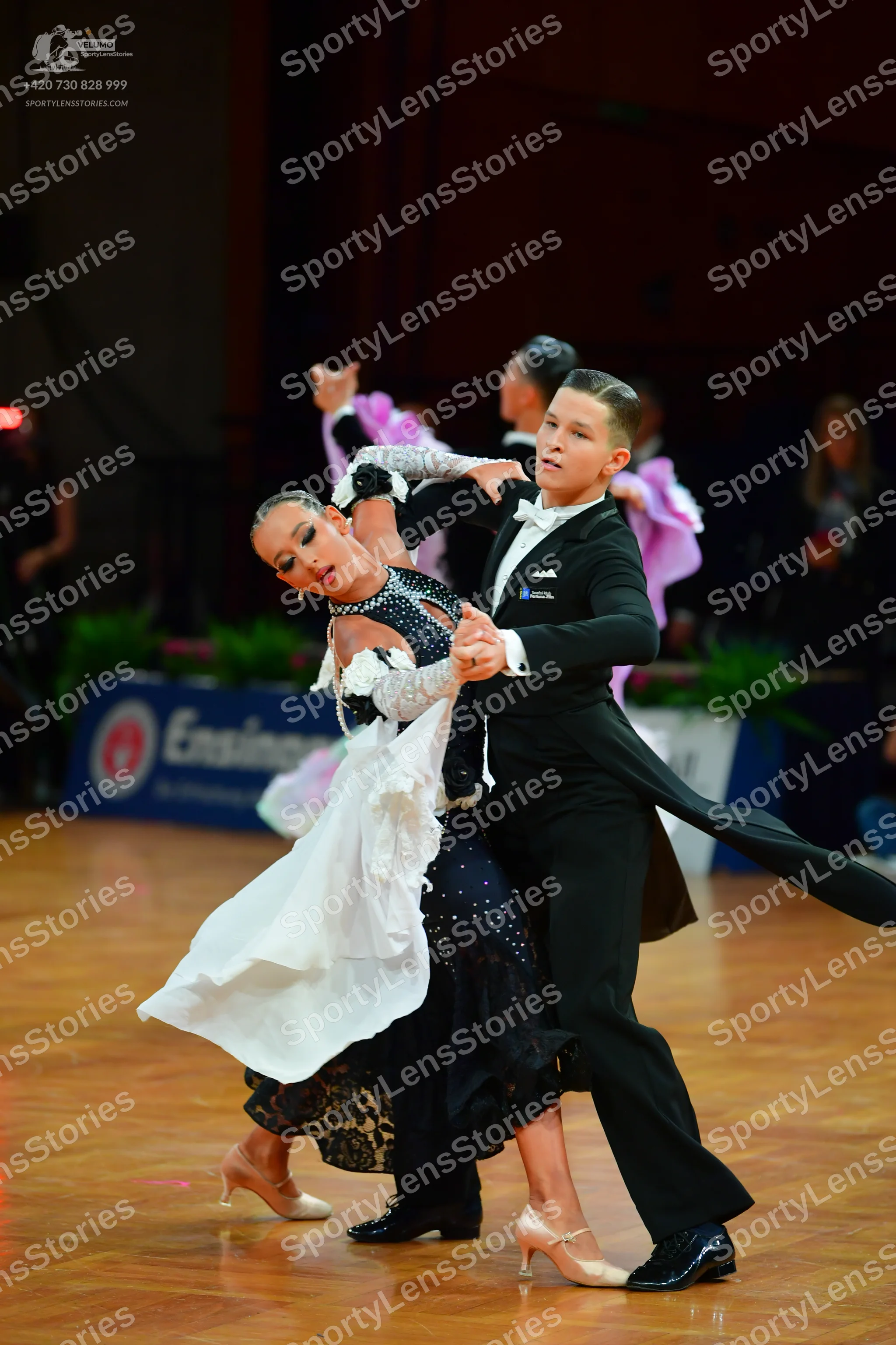Dancesport competitor: Male dancer: black ballroom tailcoat, white shirt, white bow tie, black trousers