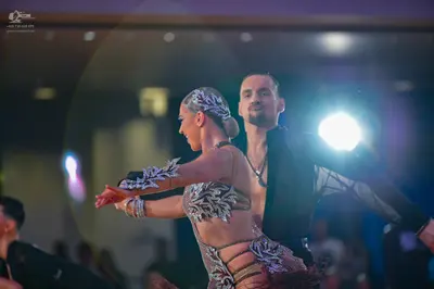 Dancesport competitor: Male dancer: black long-sleeved shirt