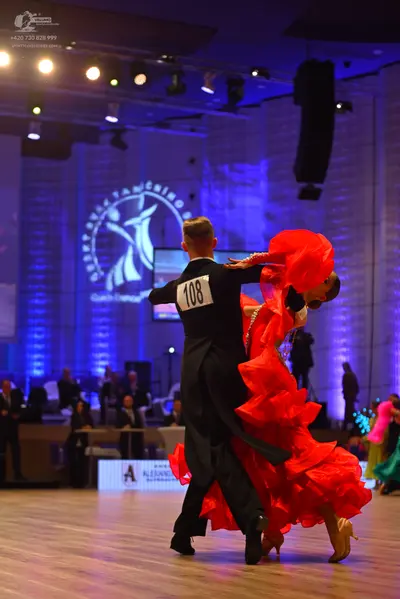 Dancesport competitor: Male dancer: black suit