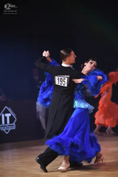 Dancesport competitor: Male dancer: black tailcoat and trousers with a white shirt collar