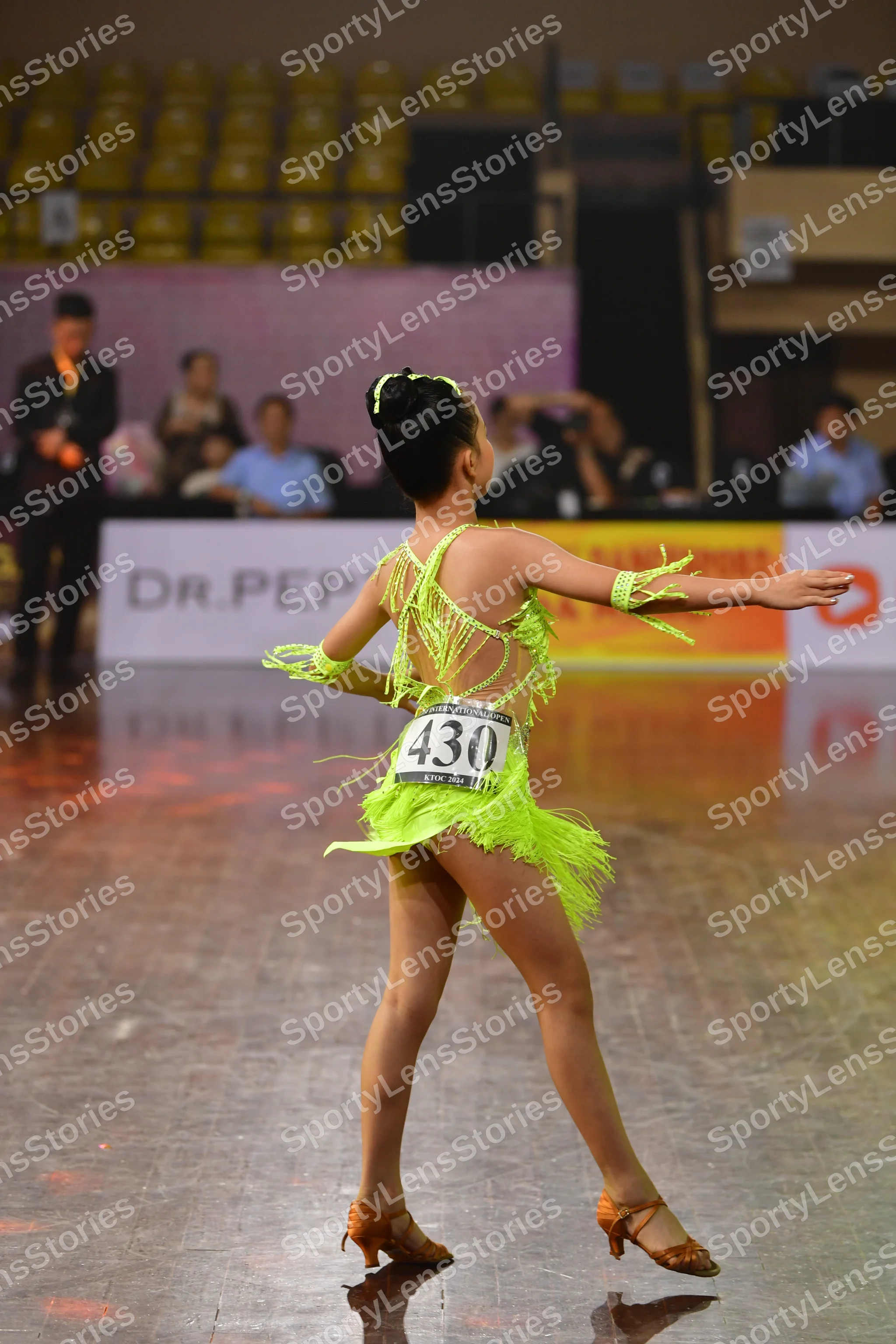 Dancesport competitor #430: Female dancer: lime green latin dress with fringe and matching wristbands