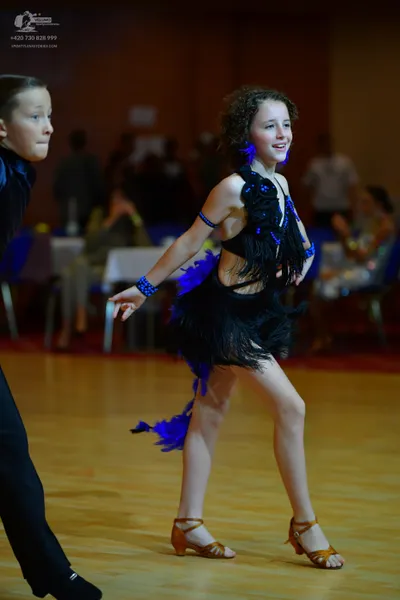 Dancesport competitor: Male dancer: black suit