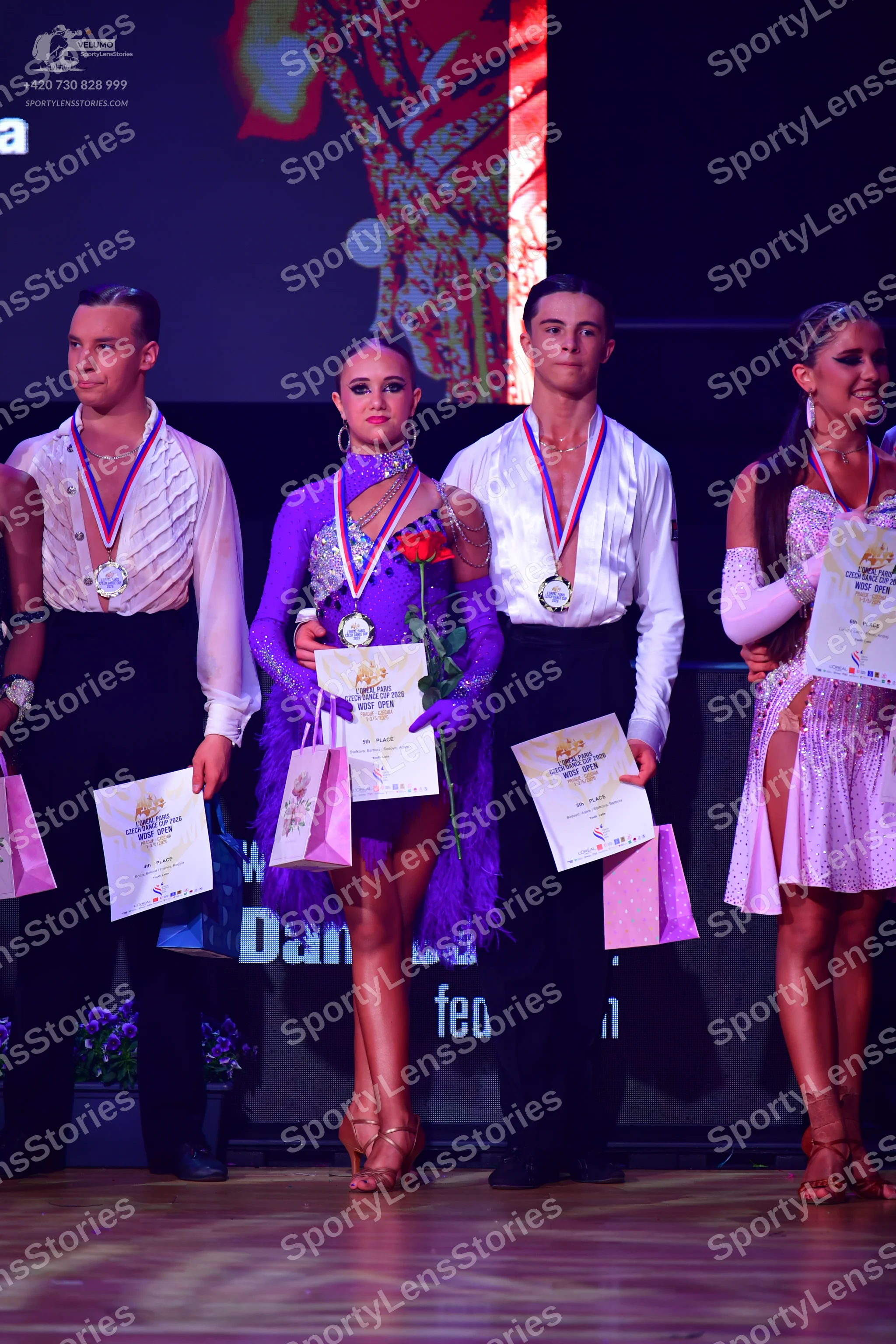 Dancesport competitor: Male dancer 1: white textured long-sleeved shirt and black trousers