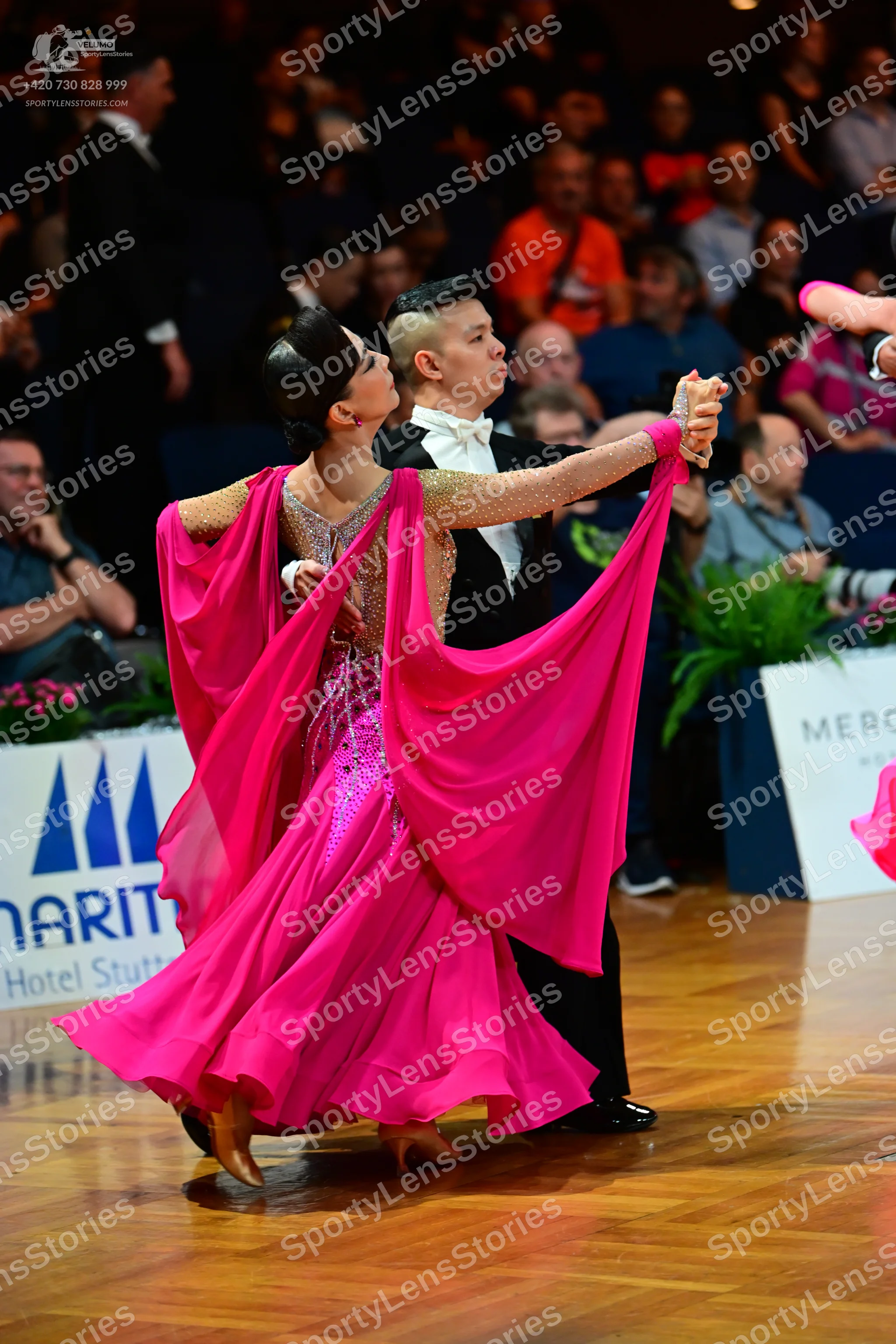 Dancesport competitor: Male dancer: black suit with a white shirt and white bow tie