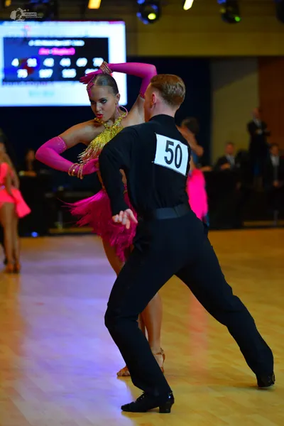 Dancesport competitor #50: Male dancer: black long-sleeved shirt and black trousers