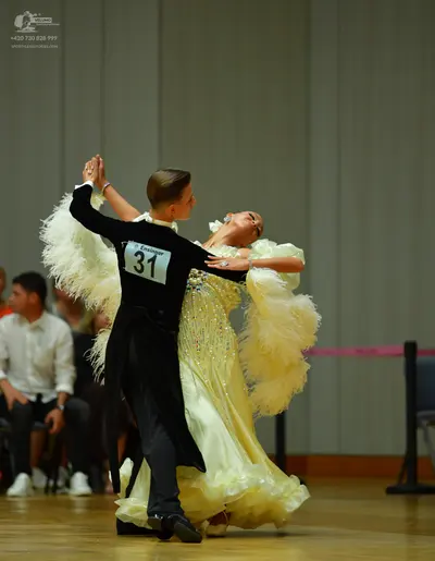 Dancesport competitor: Male dancer: black long-sleeved top and trousers