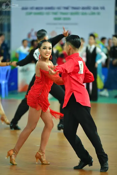 Dancesport competitor: ** Red Latin dress