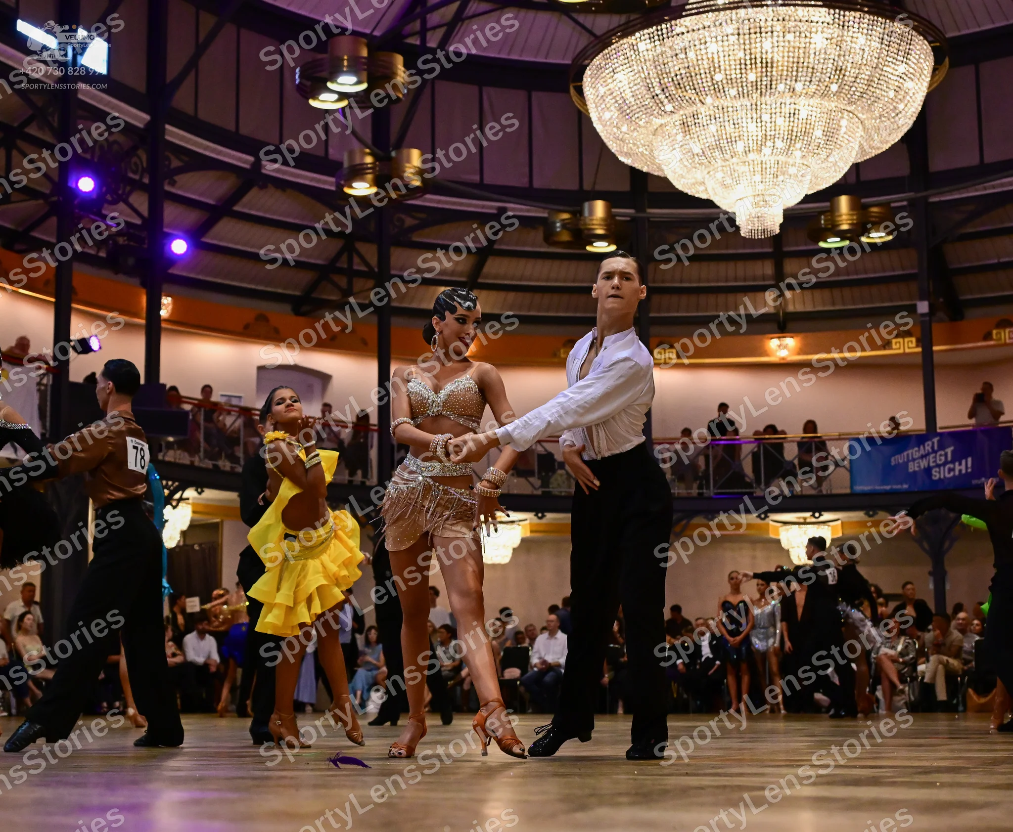Dancesport competitor #718: Male dancer: brown shirt and black trousers