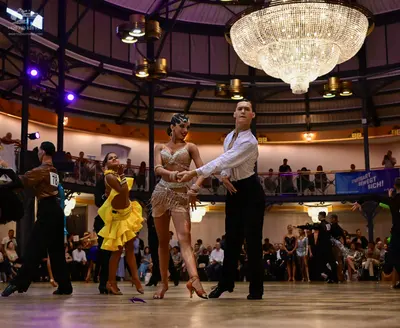 Dancesport competitor #718: Male dancer: brown shirt and black trousers