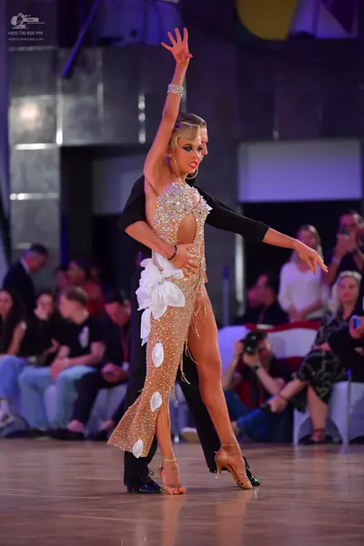 Dancesport competitor: Male dancer: black suit